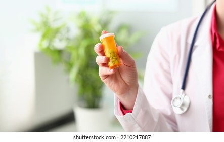 Female Doctor Hand Holding Medical Pills Or Pill Jar Mockup