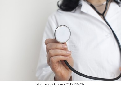 Female Doctor Hand Holding Stethoscope, Closeup