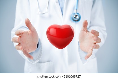 Female Doctor Hands Holding A 3d Illustration Of Red Heart.