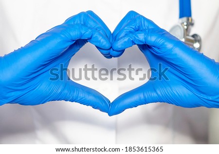 Female doctor hands showing heart shape closeup. Medical help. Cardiology care, health, protection and prevention. Healthy heart concept.