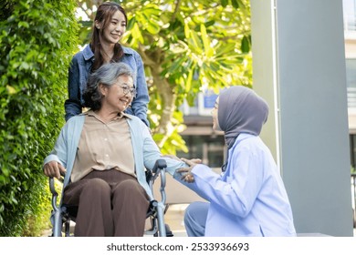 Female doctor in hijab comforting elderly woman in wheelchair with caregiver showing compassion and support in healthcare setting, concept of patient care and family love, senior patient interaction - Powered by Shutterstock