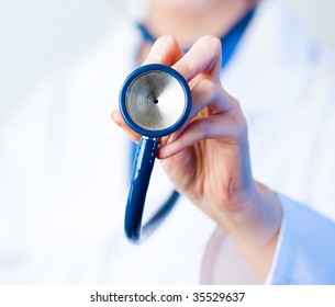 Female Doctor Holding Out Stethescope