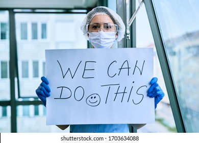 Female Doctor Holding Placard With We Can Do This Text As Sing Of A Support During Coronavirus Epidemic. 