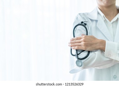 female doctor holding stethoscope with copy space