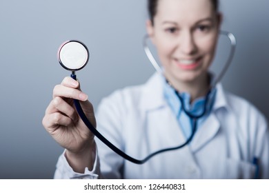 Female Doctor Holding Stethoscope (shallow Depth Of Field).