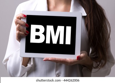 Female Doctor Holding A Tablet With The Text: BMI