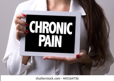 Female Doctor Holding A Tablet With The Text: Chronic Pain