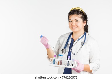 A Female Doctor Holds A Medicine Bottle In Hands, Is A Laboratory Assistant. White Background. Medicine, Laboratory Assistant