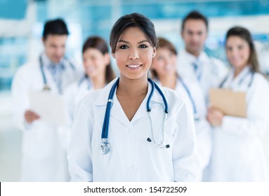 Female Doctor At The Hospital With Her Team 