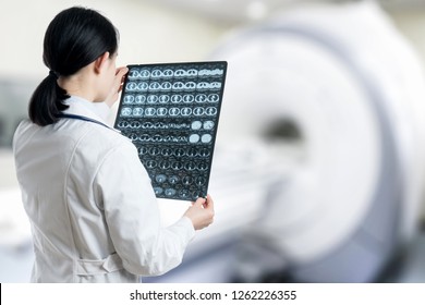 Female Doctor Is Looking At CT Image Of Lung