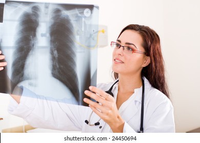 Female Doctor Looking At A Lungs Or Torso Xray