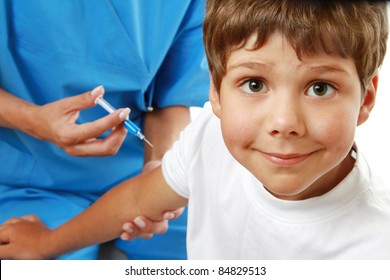 Female doctor making injection to little boy isolated - Powered by Shutterstock