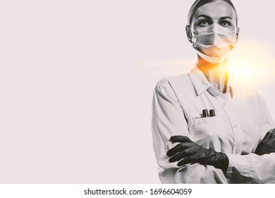 Female Doctor In Medical Mask On The Face And Gloves On A White Background