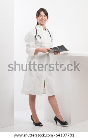 Female doctor in medicine uniform holding x ray