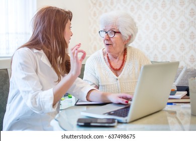 Female Doctor Or Nurse Showing Ok Sign To Senior Patient.  Medicine, Age, Health Care And Home Care Concept.