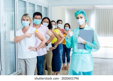 Female Doctor Nurse Wearing A Mask Group Of People After Getting The Covid-19 Vaccine, Composite Shot. A Diverse Group Of Men And Women With Band-aids On Arm After Receiving Immunity Vaccine