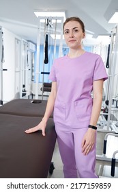 Female Doctor Physiotherapist Standing In Physical Therapy Clinic