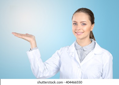 Female Doctor Pointing At Copy Space