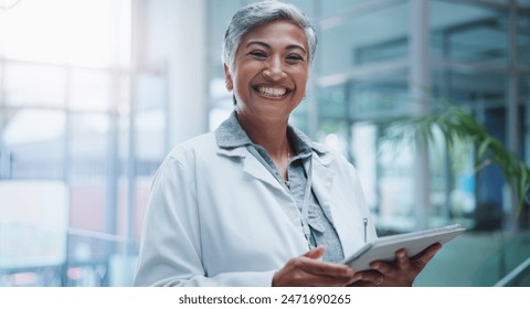 Female doctor, portrait and smile with tablet in hospital or workplace with lens flare. Communication, technology and medical research for innovation in medicine with happy healthcare professional. - Powered by Shutterstock