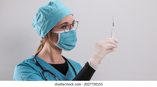 Female Doctor Prepares A Syringe With The New Corona Vaccine - Studio Photography