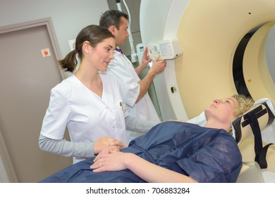 Female Doctor Preparing Patient For Ct Scan