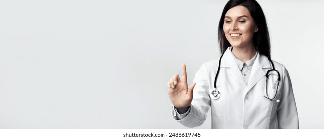 Female Doctor Pressing Invisible Button On Touchscreen Standing Over White Studio Background. - Powered by Shutterstock