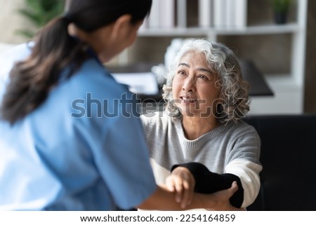 Female doctor provide medical service help support smiling old grandma at homecare medical visit.
