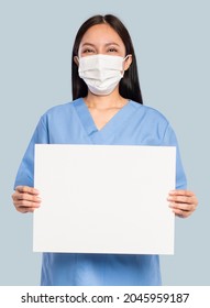 Female Doctor Showing A Blank Sign Board