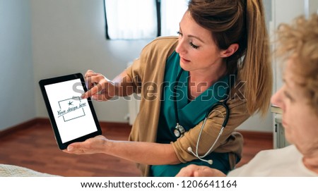 Similar – Female doctor showing an x-ray on the tablet