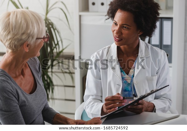 Female Doctor Sits Her Desk Chats Stock Photo 1685724592 | Shutterstock