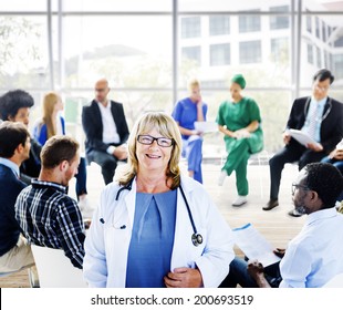 Female Doctor Standing In Front Of A Support Group