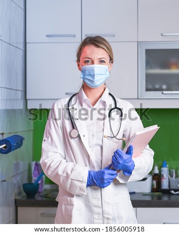 Female doctor with stethoscope wearing protective mask and latex gloves. Surgeon wearing medical mask. Confident female doctor isolated.