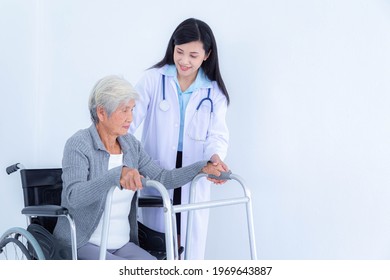 Female doctor supporting senior woman by using walker. Elderly patient care and health care, medical concept.