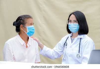 The female doctor supports the patient's shoulder, the elderly and guides friendly health care. - Shutterstock ID 1966560604