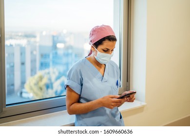 Female Doctor Surgeon Using Smart Phone.