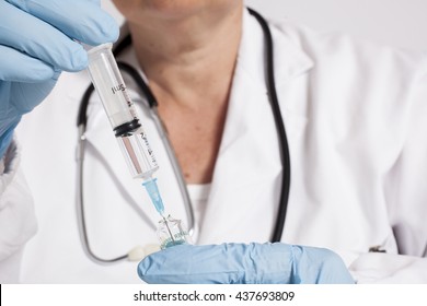Female doctor with syringe 