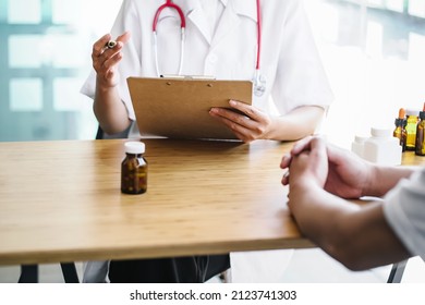 Female Doctor Taking A Patient History, Close Up At Hands Of Female Doctor Explain Hand Gesture.