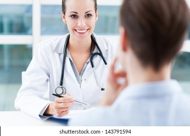 Female Doctor Talking To Patient
