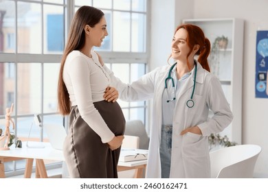 Female doctor talking to pregnant woman in clinic - Powered by Shutterstock