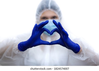 Female doctor teaching How to wearing Surgical mask for protect Covid-19 (coronavirus) making sign Heart by fingers - Shutterstock ID 1824574007
