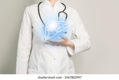 Female doctor in uniform holds in hands a handrawn icon of blue healthy highlighted liver. Neutral background with copy space for text.
