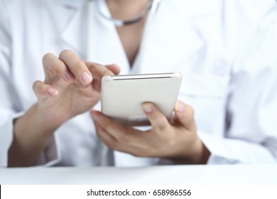 Female Doctor Using Cell Phone