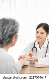 Female doctor using hand to checking the pulse. Doctor checking patient's pulse. medical check up - Shutterstock ID 2217074649