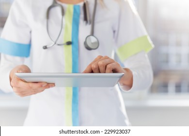 Female doctor using ipad at work in hospital