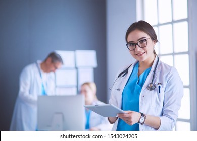 Female doctor using tablet computer in hospital lobby - Shutterstock ID 1543024205