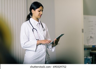 Female Doctor Using A Tablet Pc.