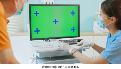 Female Doctor Wearing Face Mask Explain Disease And Medicare To Elder Senior Man Patient With Computer In Green Screen