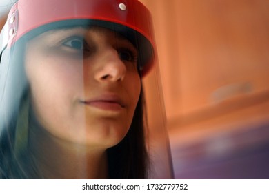 Female Doctor Wearing Face Shield And PPE Suit For Coronavirus Outbreak.          