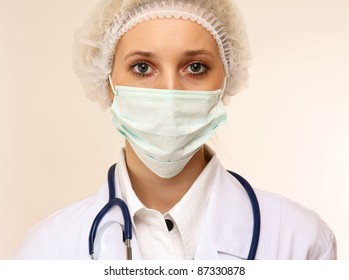 A Female Doctor Wearing A Mask, Isolated On White