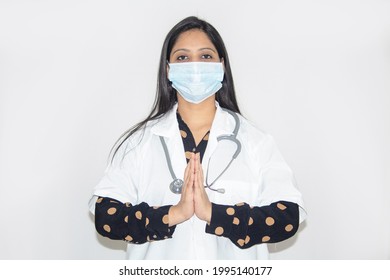 Female Doctor Wearing Protective Face Mask And Greeting With Prayer Pose Requesting To Cooperate To Prevent Spread Of Virus Disease